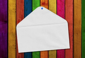 A blank white envelope on a striped background